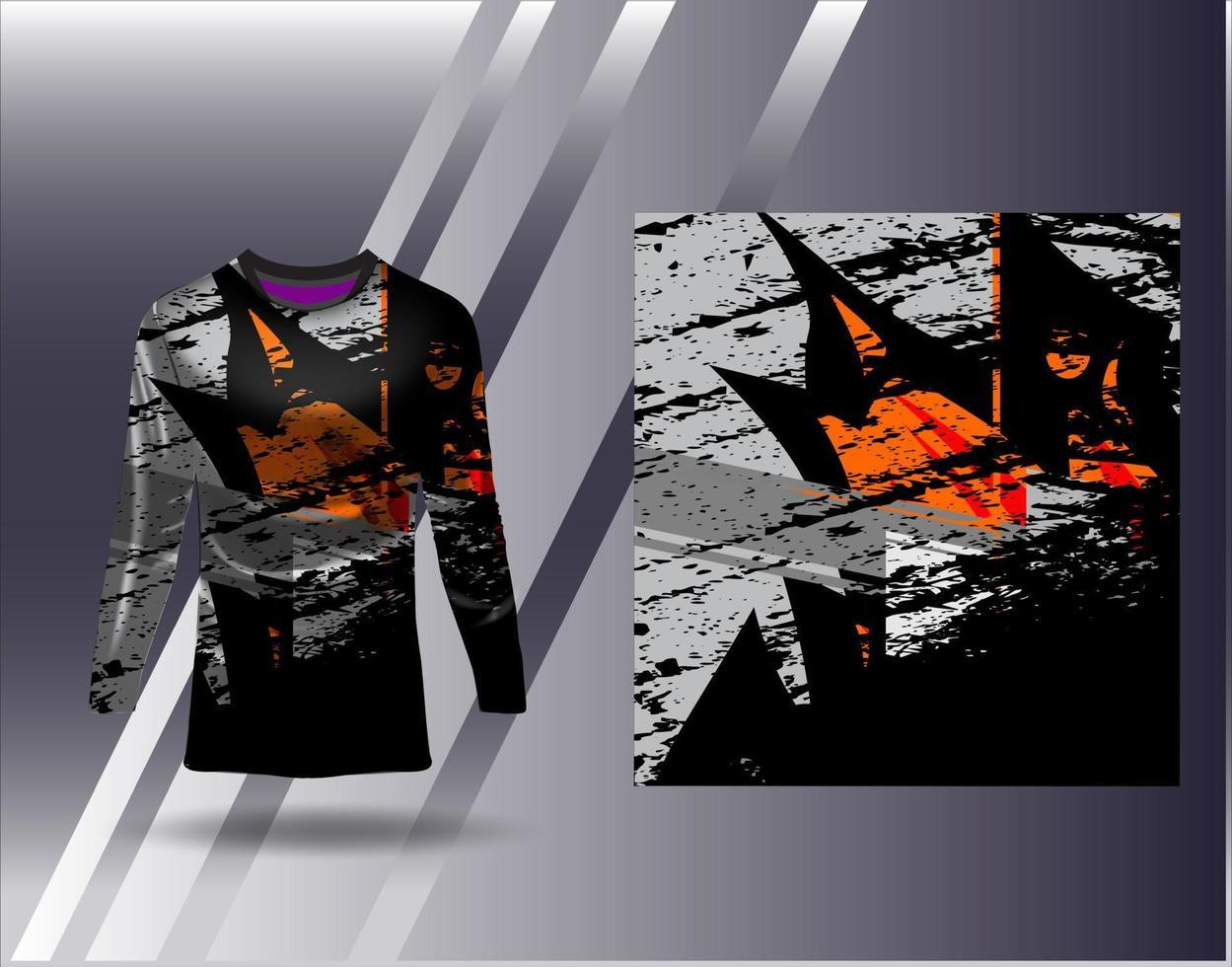 A long-sleeve graphic shirt featuring abstract black, gray, and orange designs, displayed against a sleek gray background.
