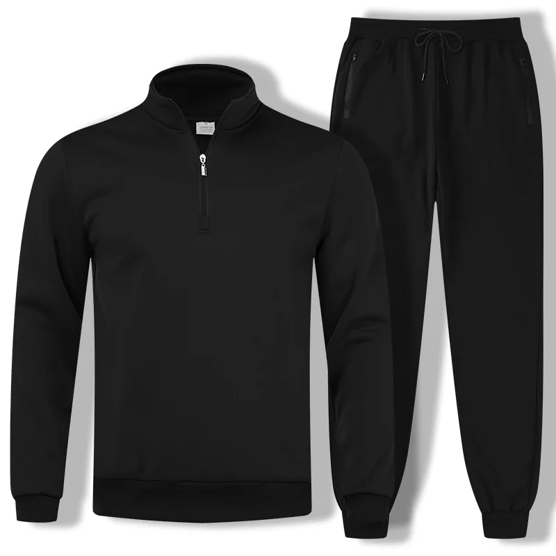 Black athletic tracksuit consisting of a quarter-zip sweatshirt and matching joggers, ideal for workouts or casual wear.