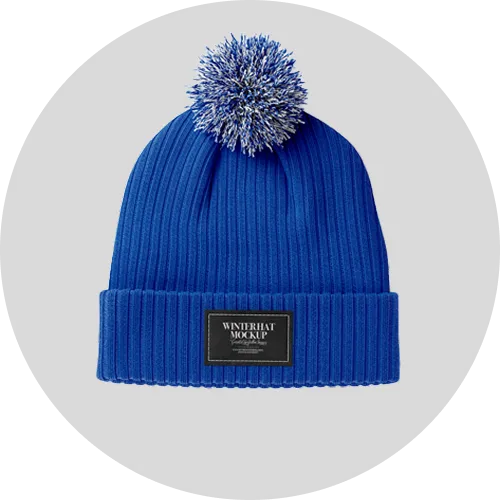 Bright blue knitted winter hat featuring a pom-pom on top and a black label on the cuff.