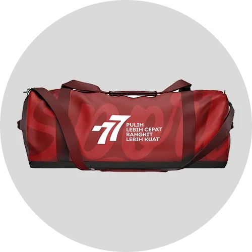 Red duffel bag with a white logo featuring the number "-7" and the text "Pulih Lebih Cepat, Bangkit Lebih Kuat."