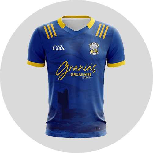 Blue sports jersey with yellow accents, featuring the GAA logo, "Gráinín's", and "Gruagaire Easkey" text, displayed on a round background.