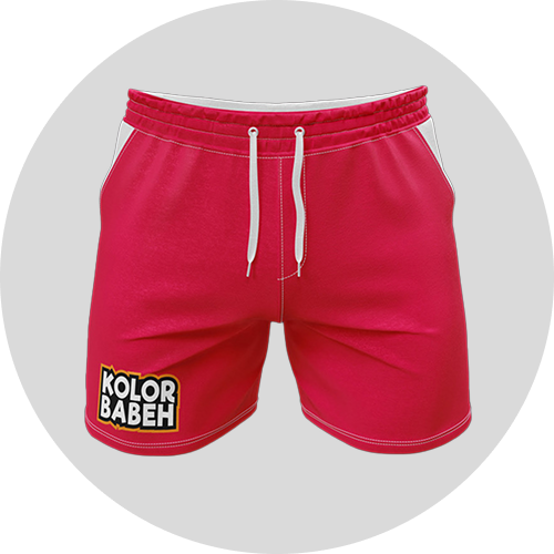 Bright pink shorts with white drawstrings and a "KOLOR BABEH" logo on the left side, displayed on a light gray circular background.